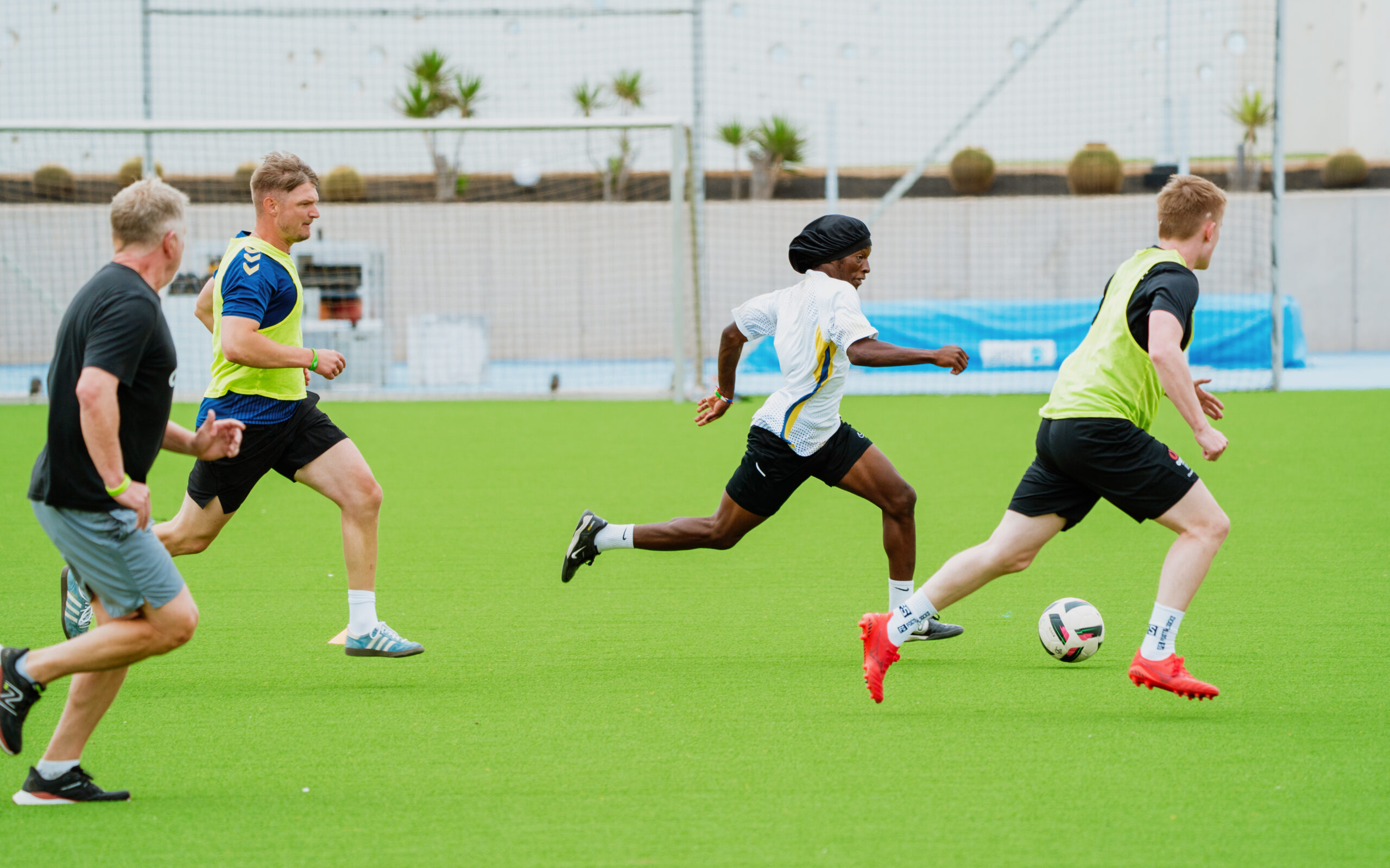 A group of men running during a game of football