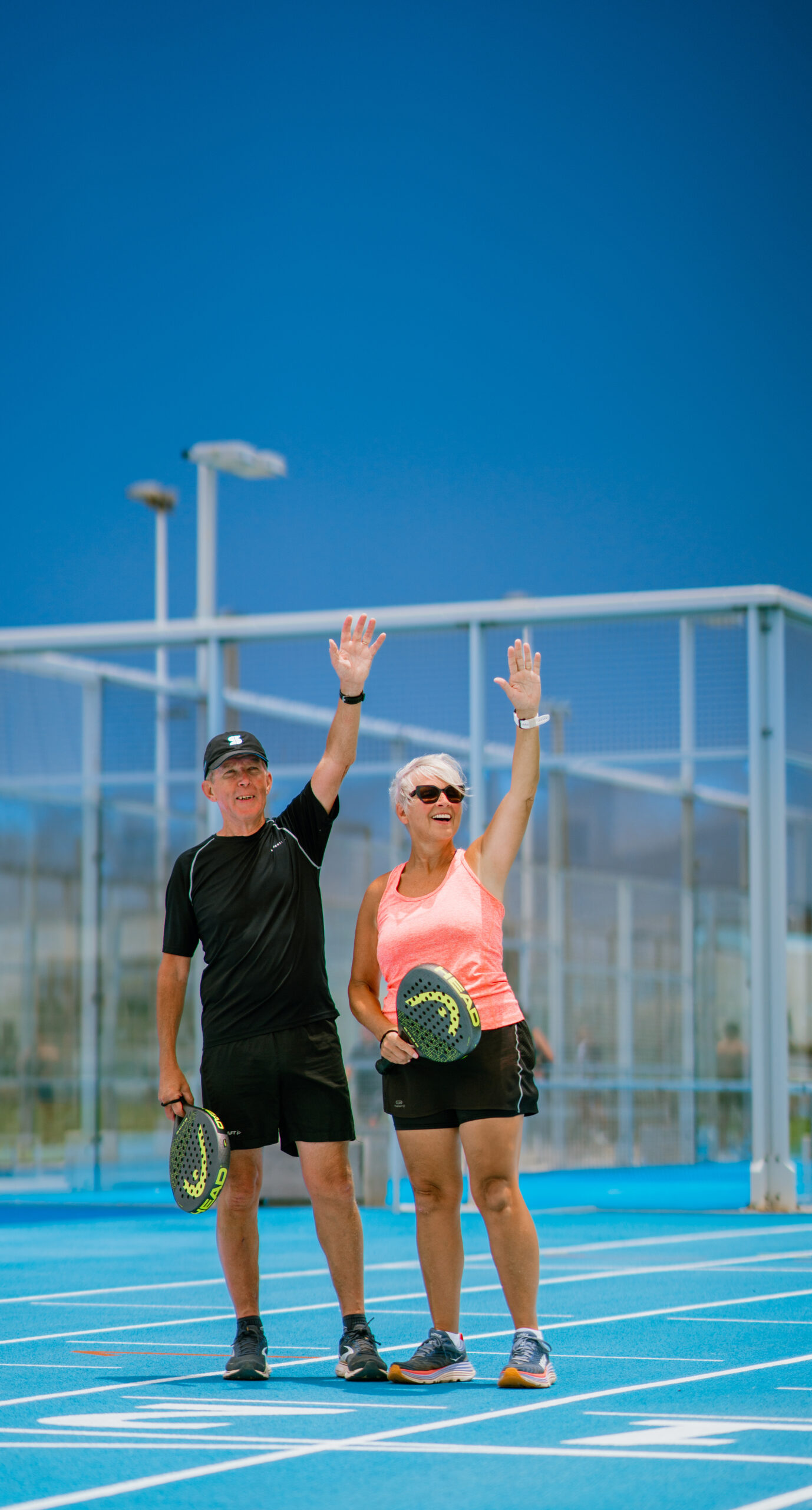 Two people holding padel rackets at Club La Santa
