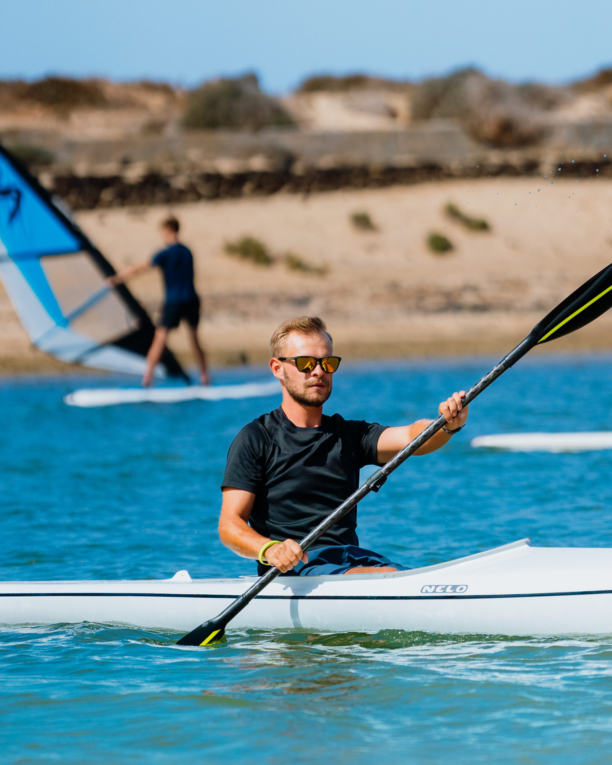 A man kayaking at the lagoon at club la santa