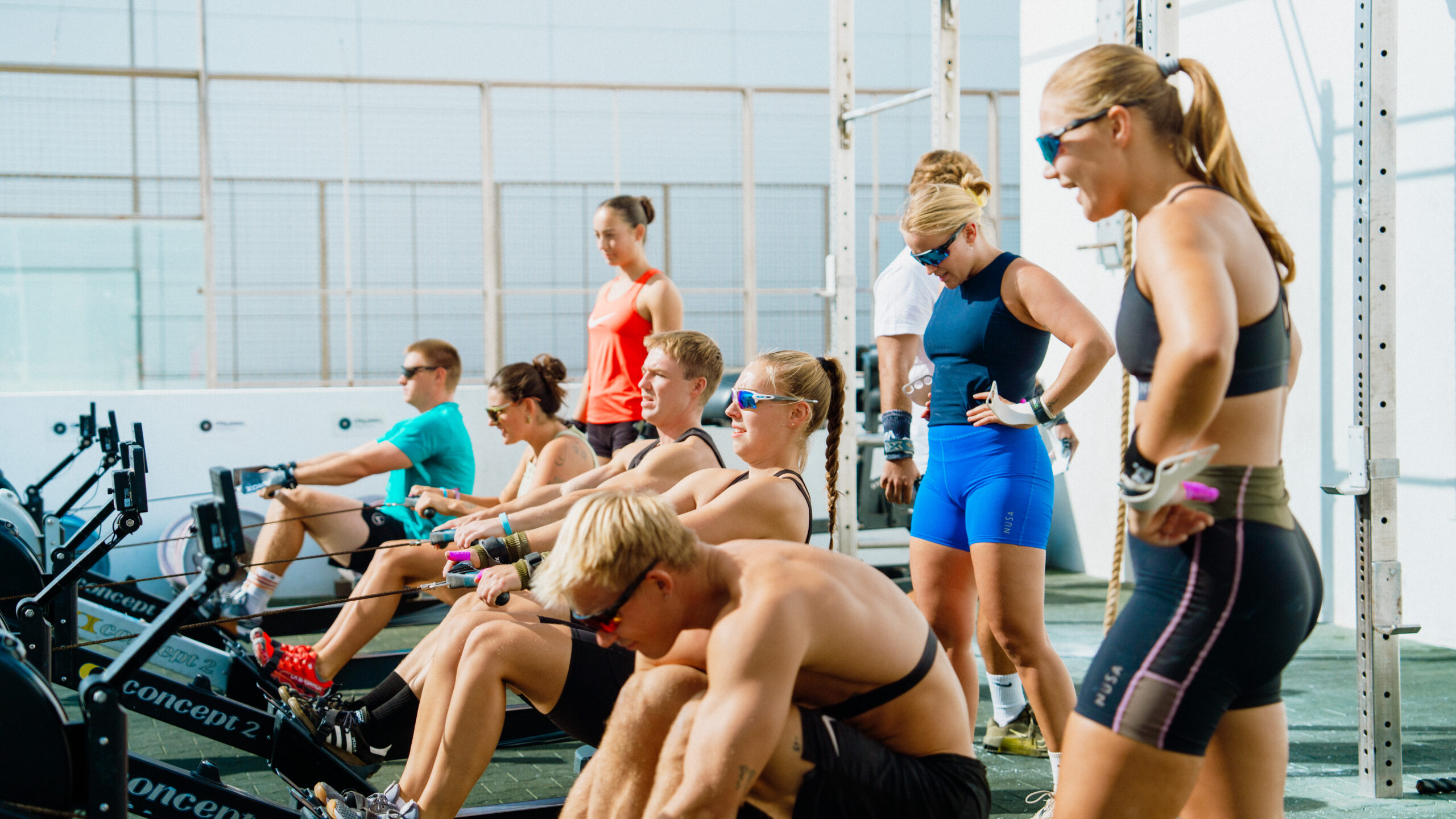 Group of athletes training on Concept2 rowing machines during an outdoor CrossFit session at Club La Santa.