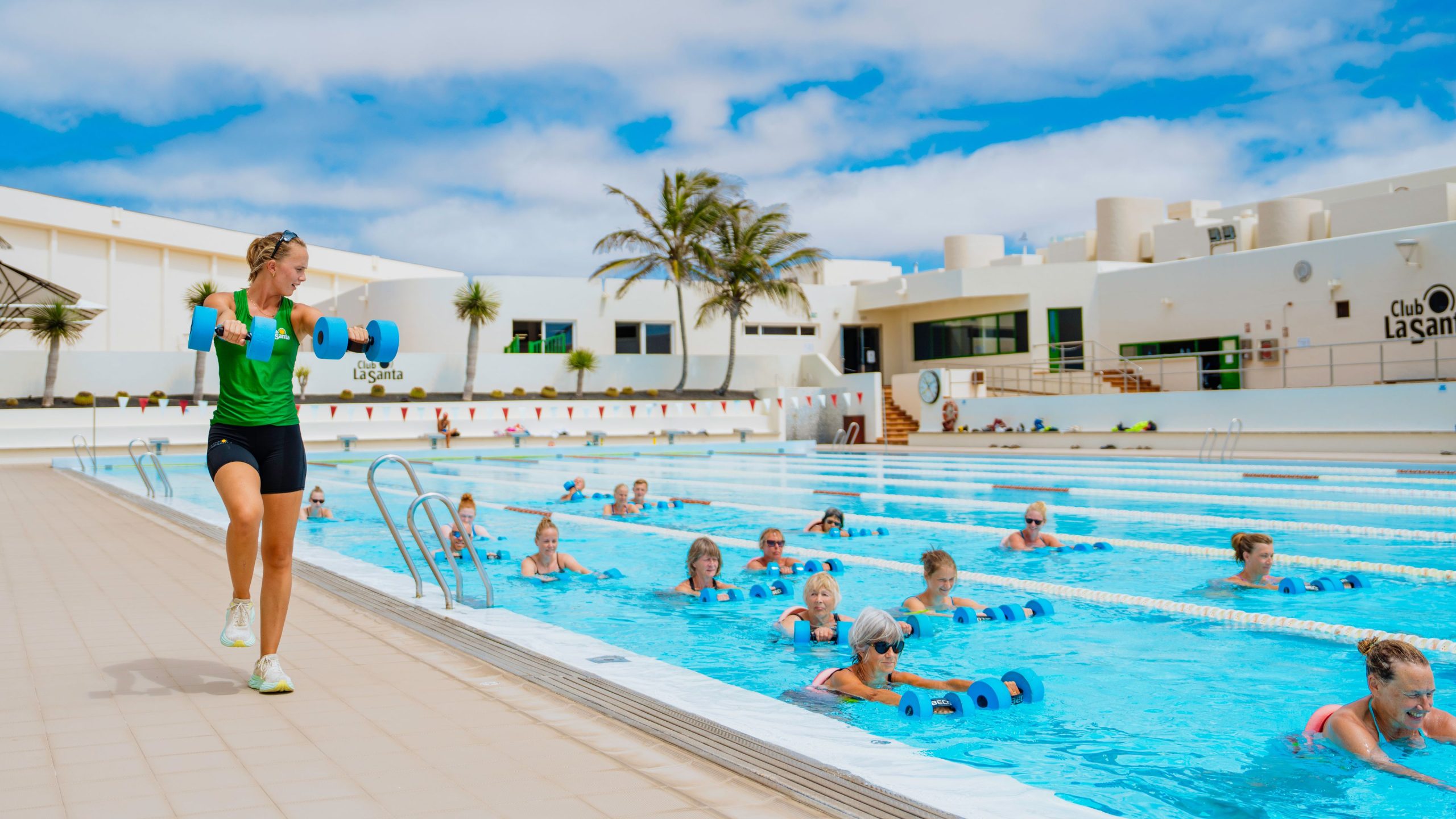 People using foam weights in a deep water aqua aerobics class at Club La Santa