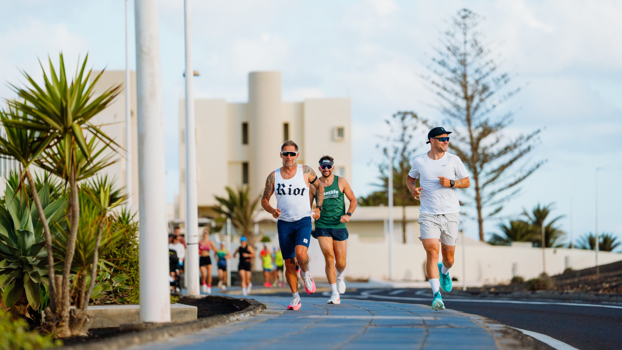 A group of athletes running on the roads surrounding Club La Santa on their long distance triathlon training camp.