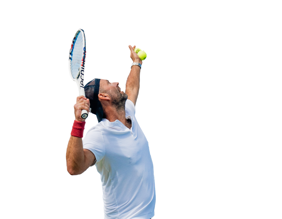 A tennis player about to serve