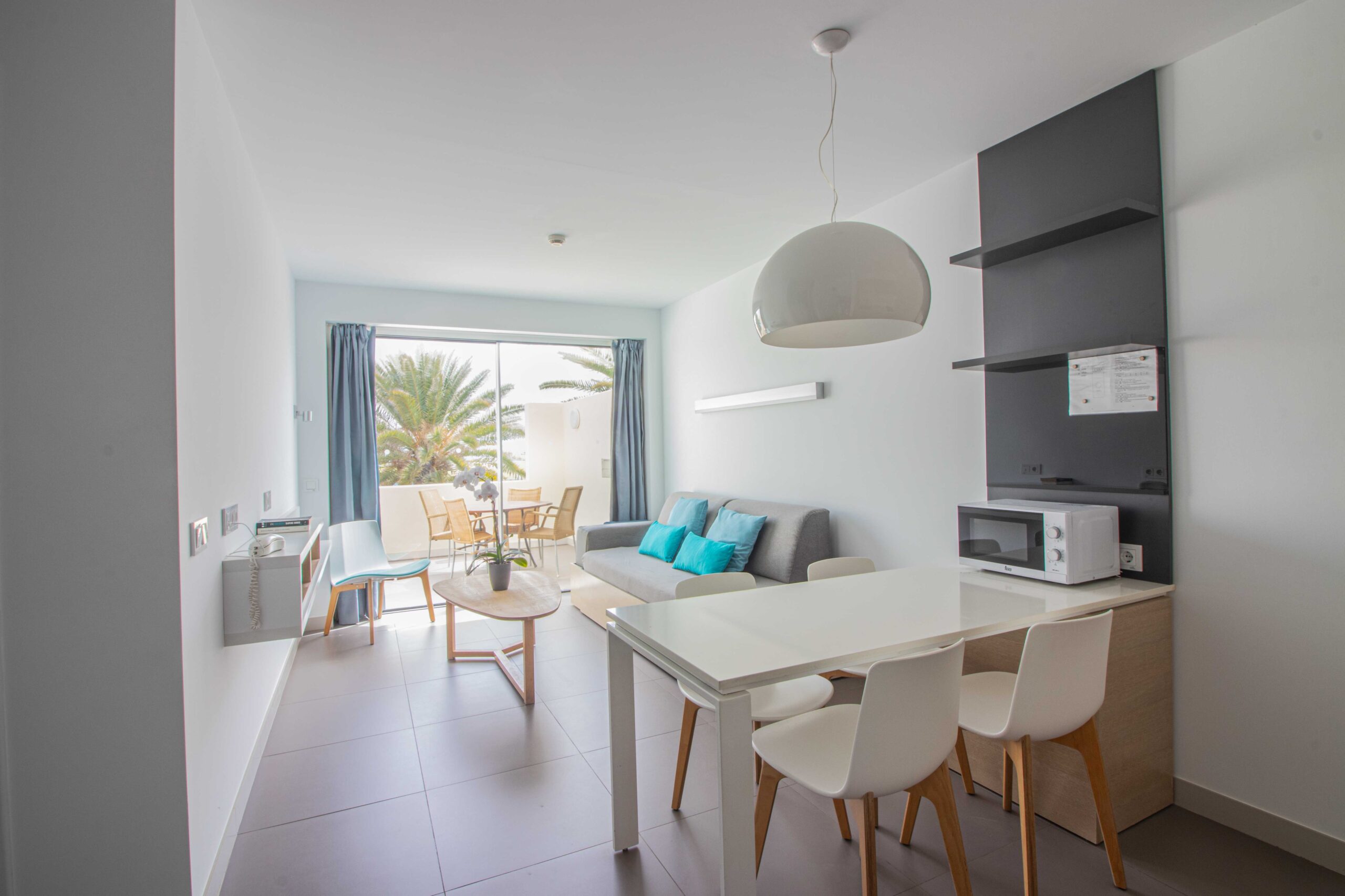 Image of Comfort 1 Bedroom 1 Bathroom apartment with view, showing the living room and kitchen.