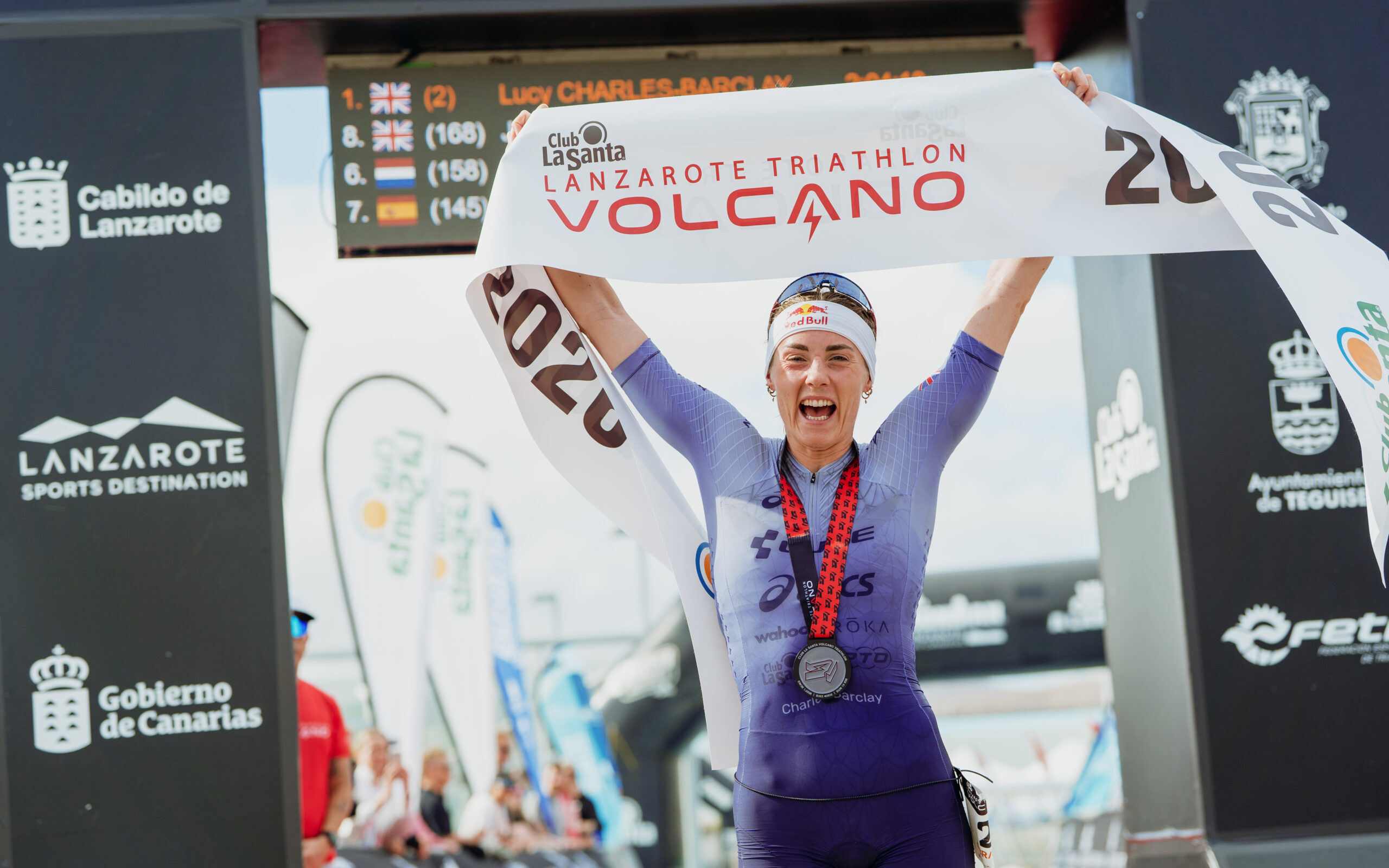 Lucy Charles Barclay crossing the finish line at the Volcano Triathlon