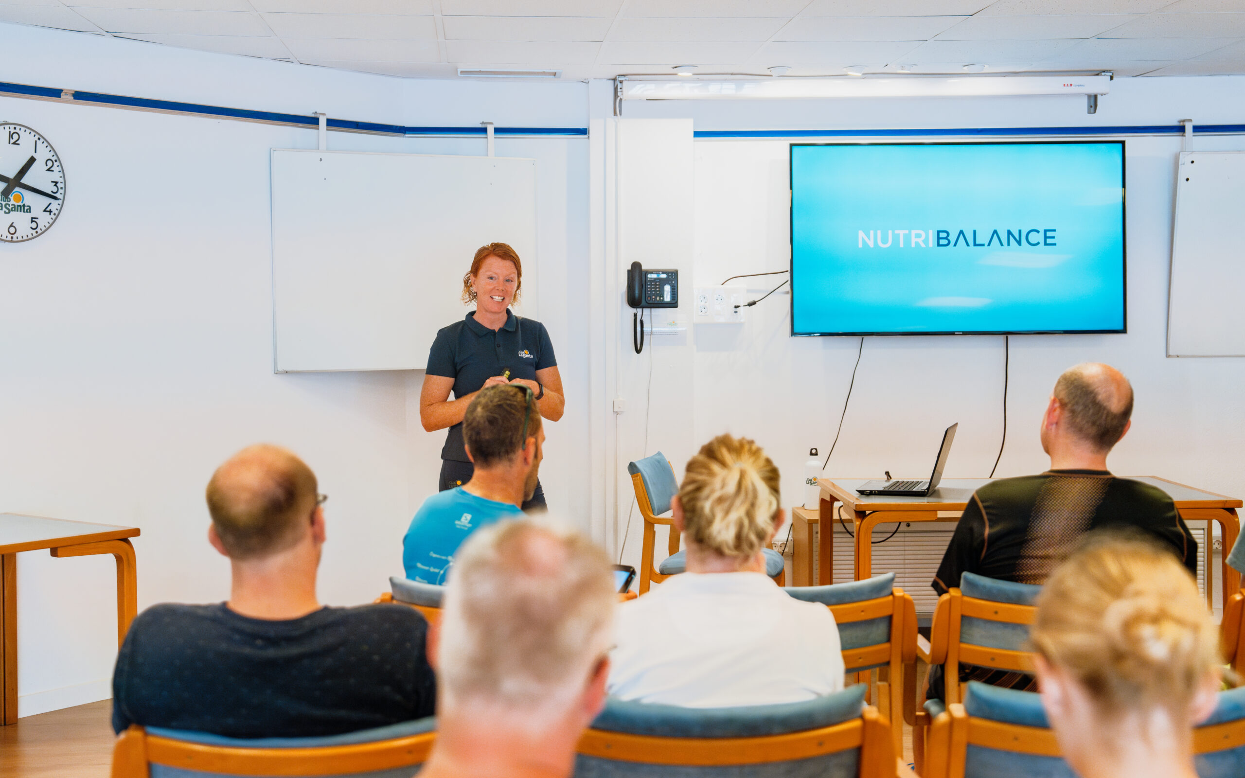 A woman giving a presentation about NutriBalance